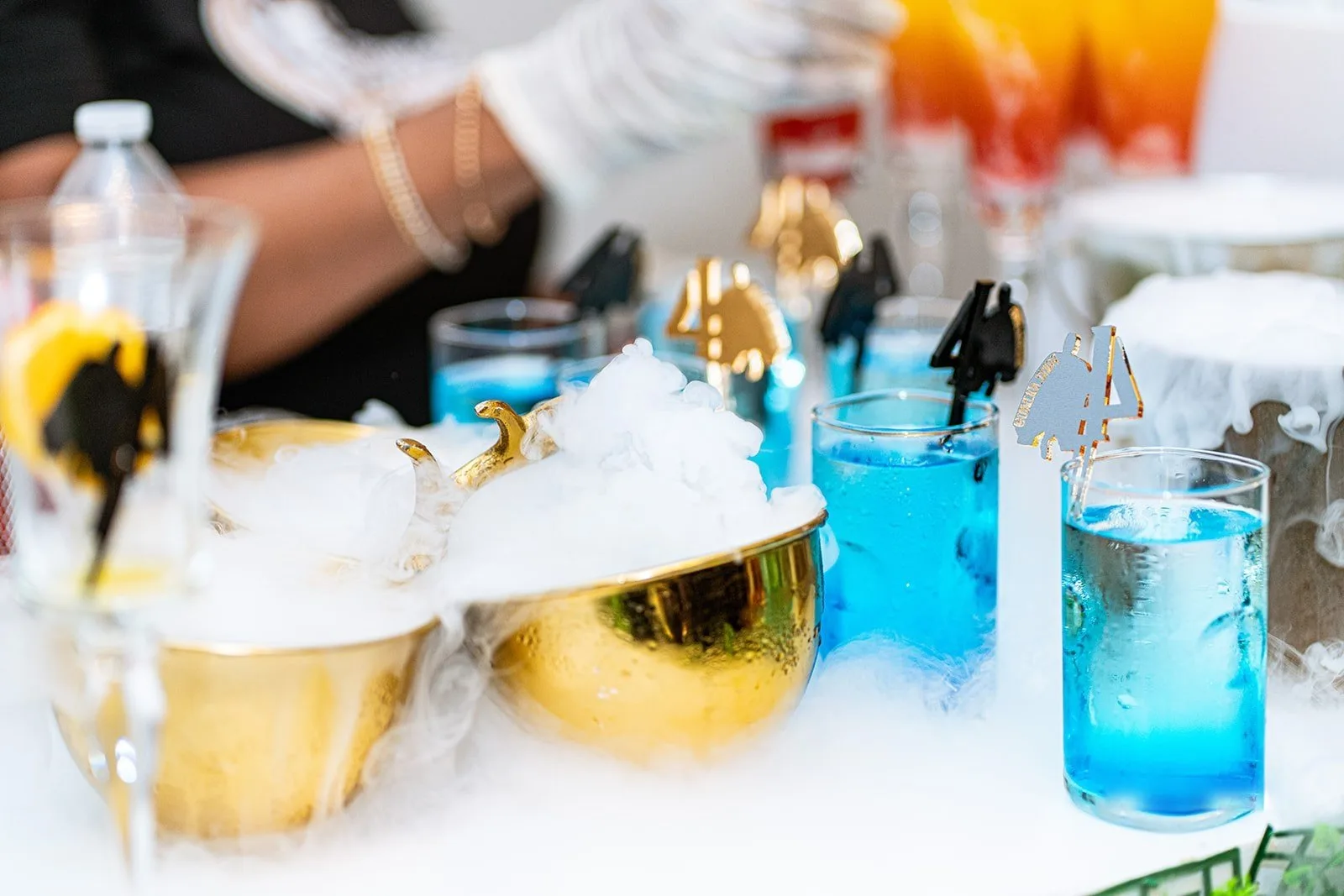 Drinks station with blue cocktails at an event